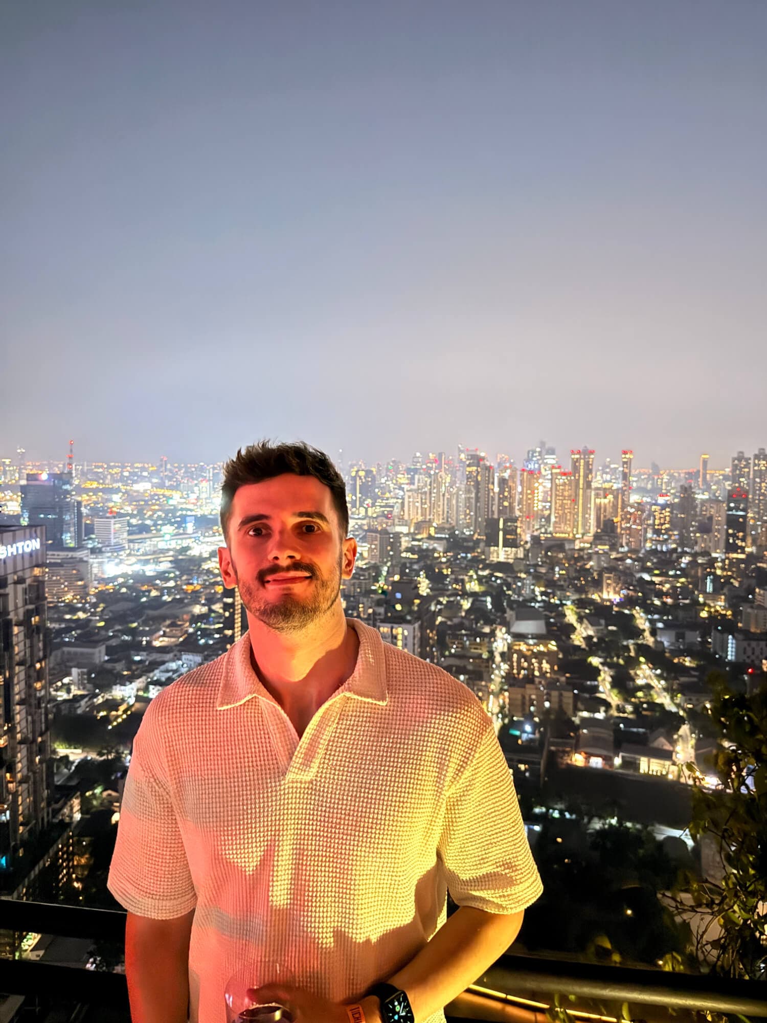 Photo of Ben with the Bangkok skyline